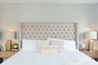 white bed linen with white pillows