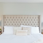 white bed linen with white pillows