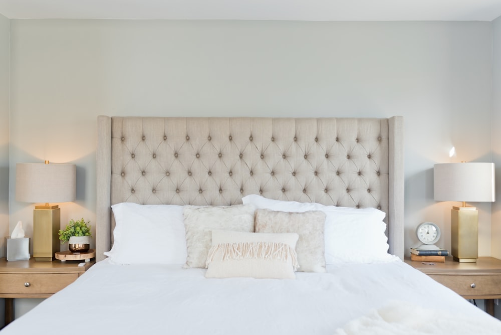 white bed linen with white pillows