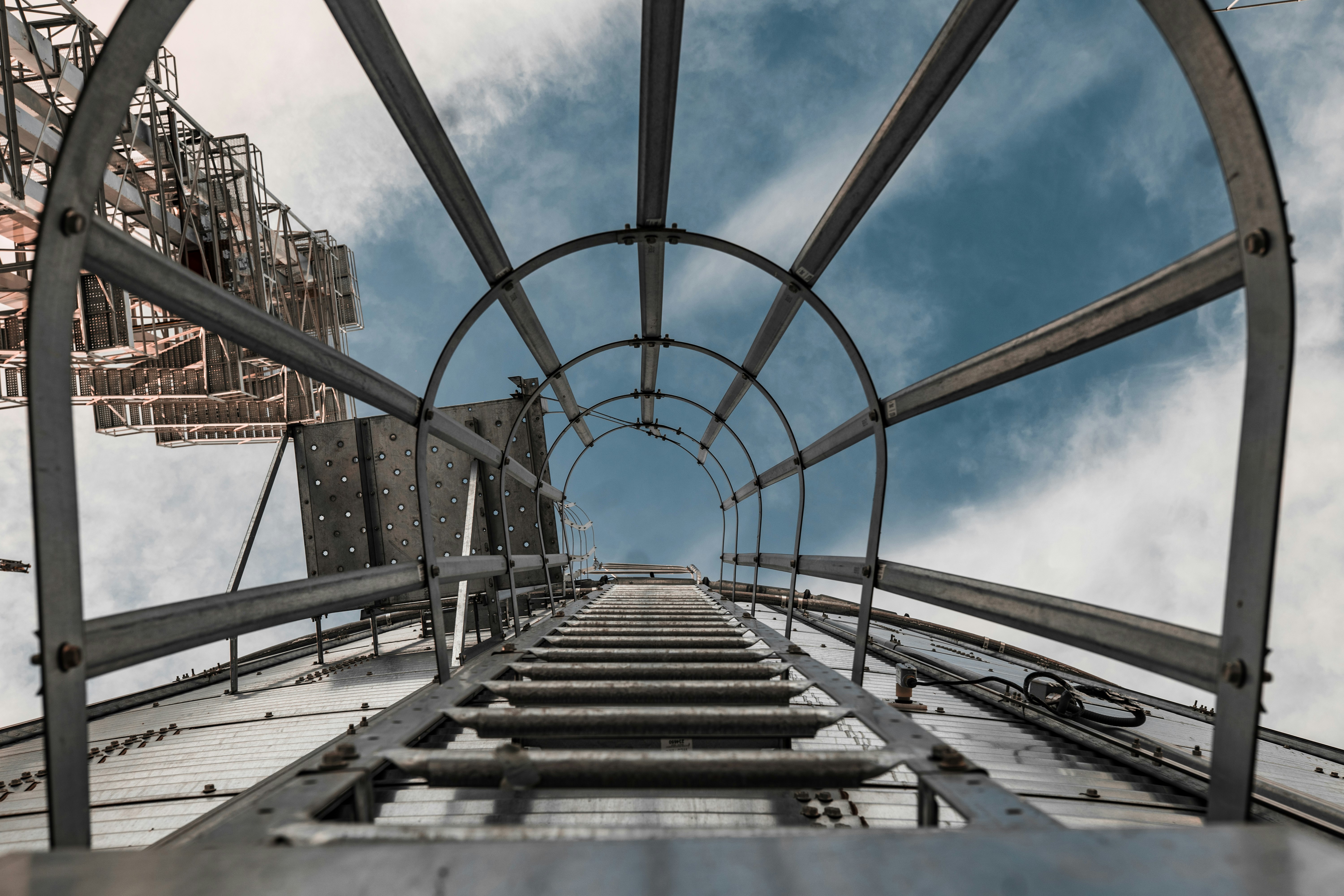 brown and gray metal bridge under blue sky during daytime