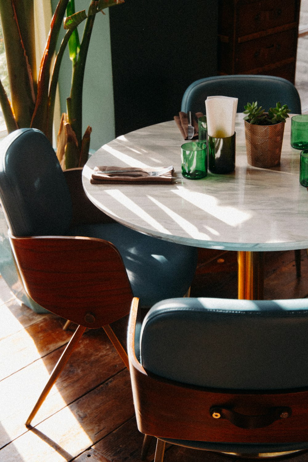 brown wooden table with chairs