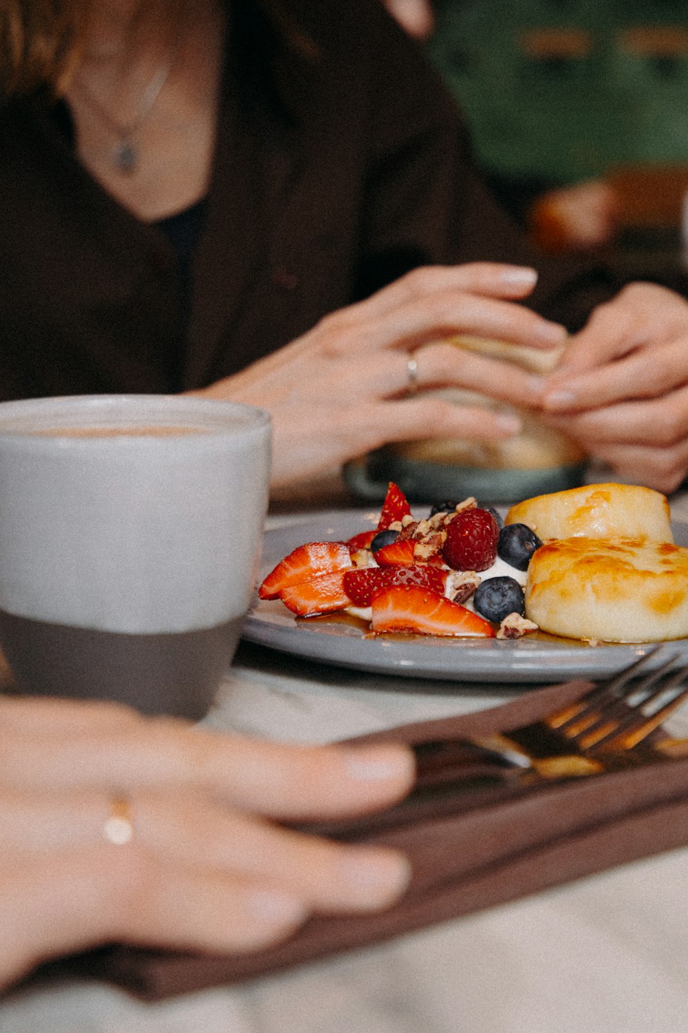 person holding white ceramic mug