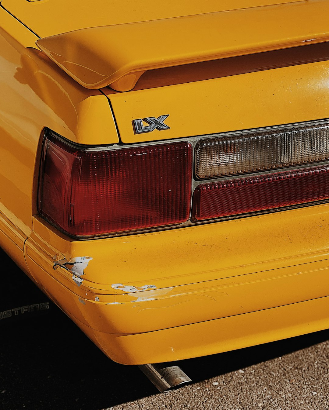 yellow car with white and black license plate