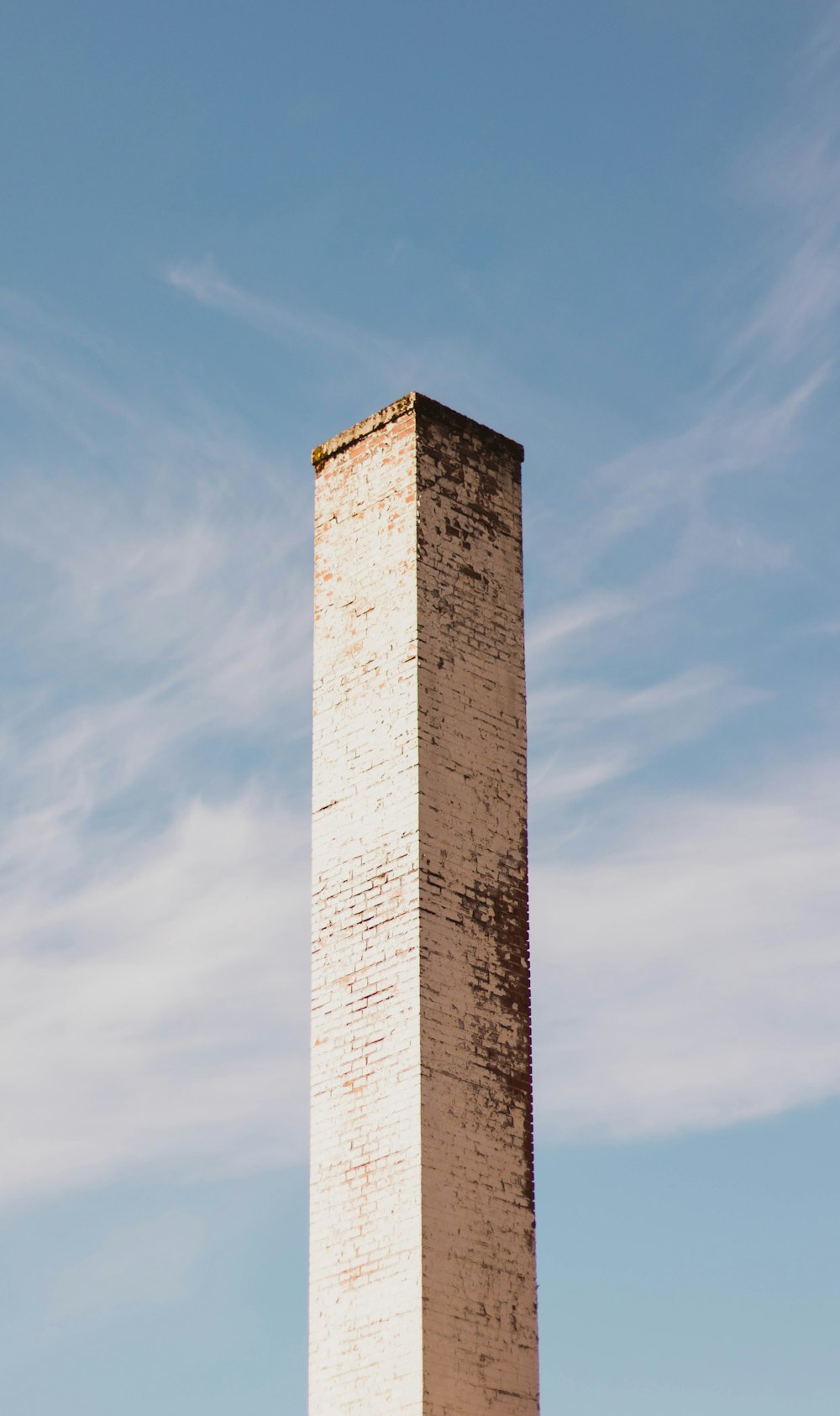 brown concrete tower under blue sky during daytime