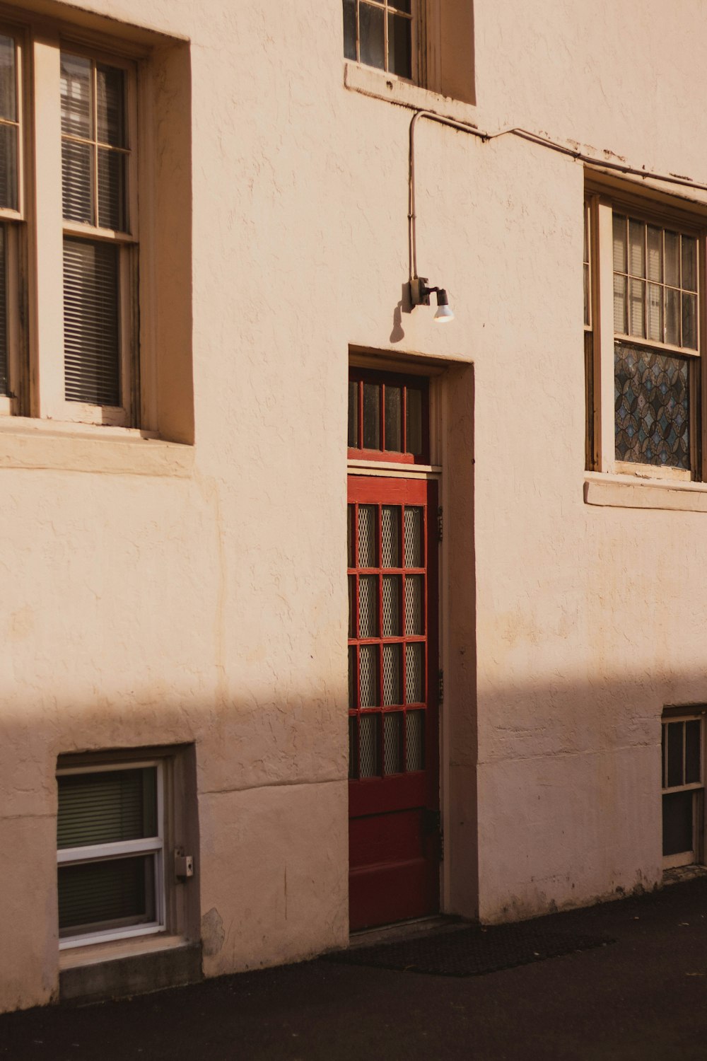 brown wooden window frame on white concrete wall