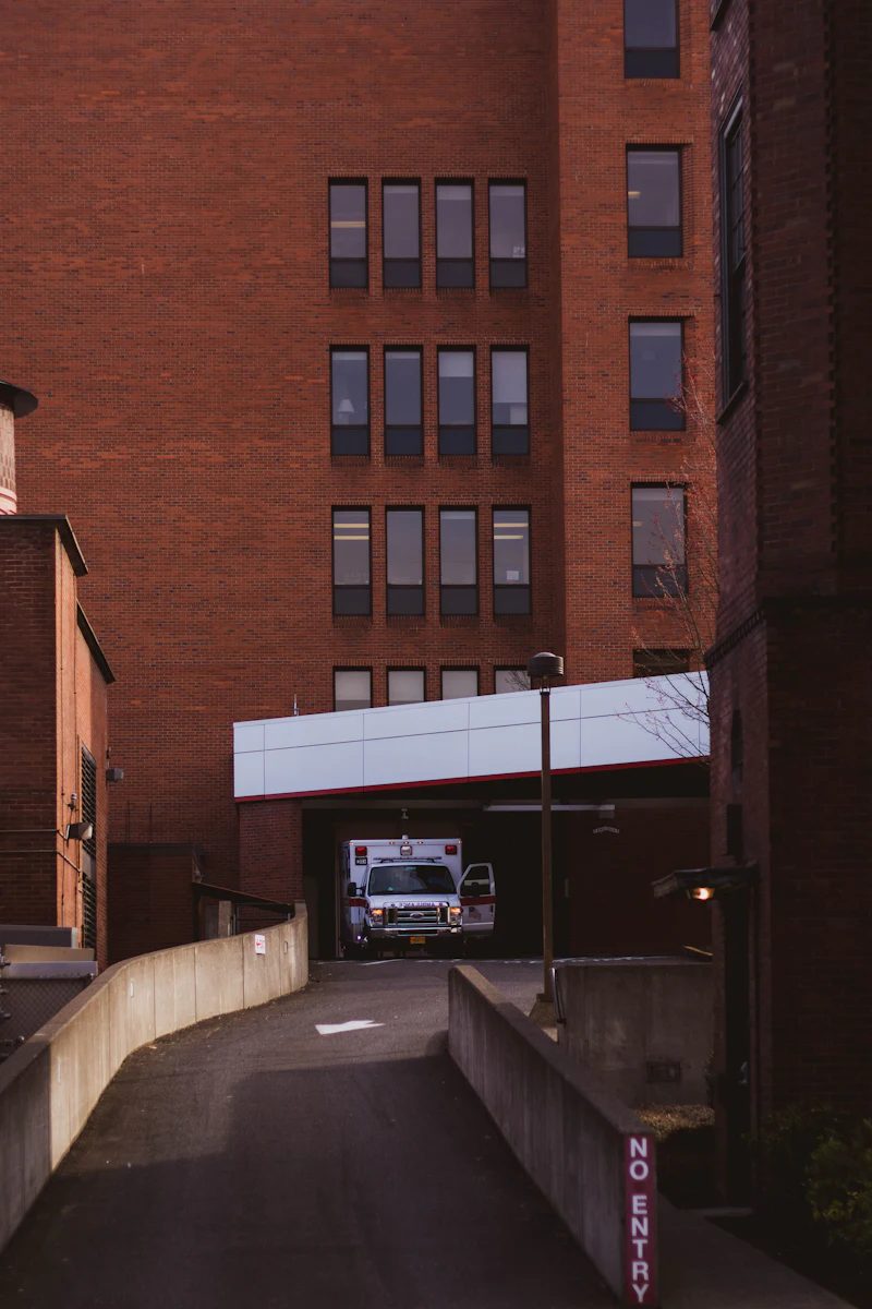 White van parked beside a building