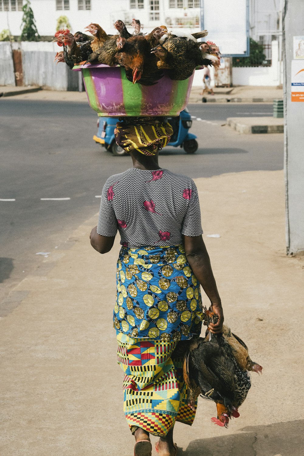 girl in purple and blue floral dress wearing helmet