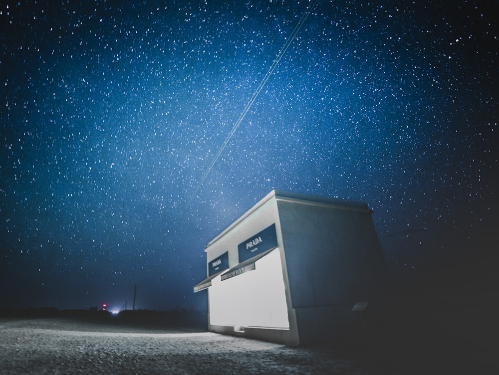 white and black house under blue sky during night time