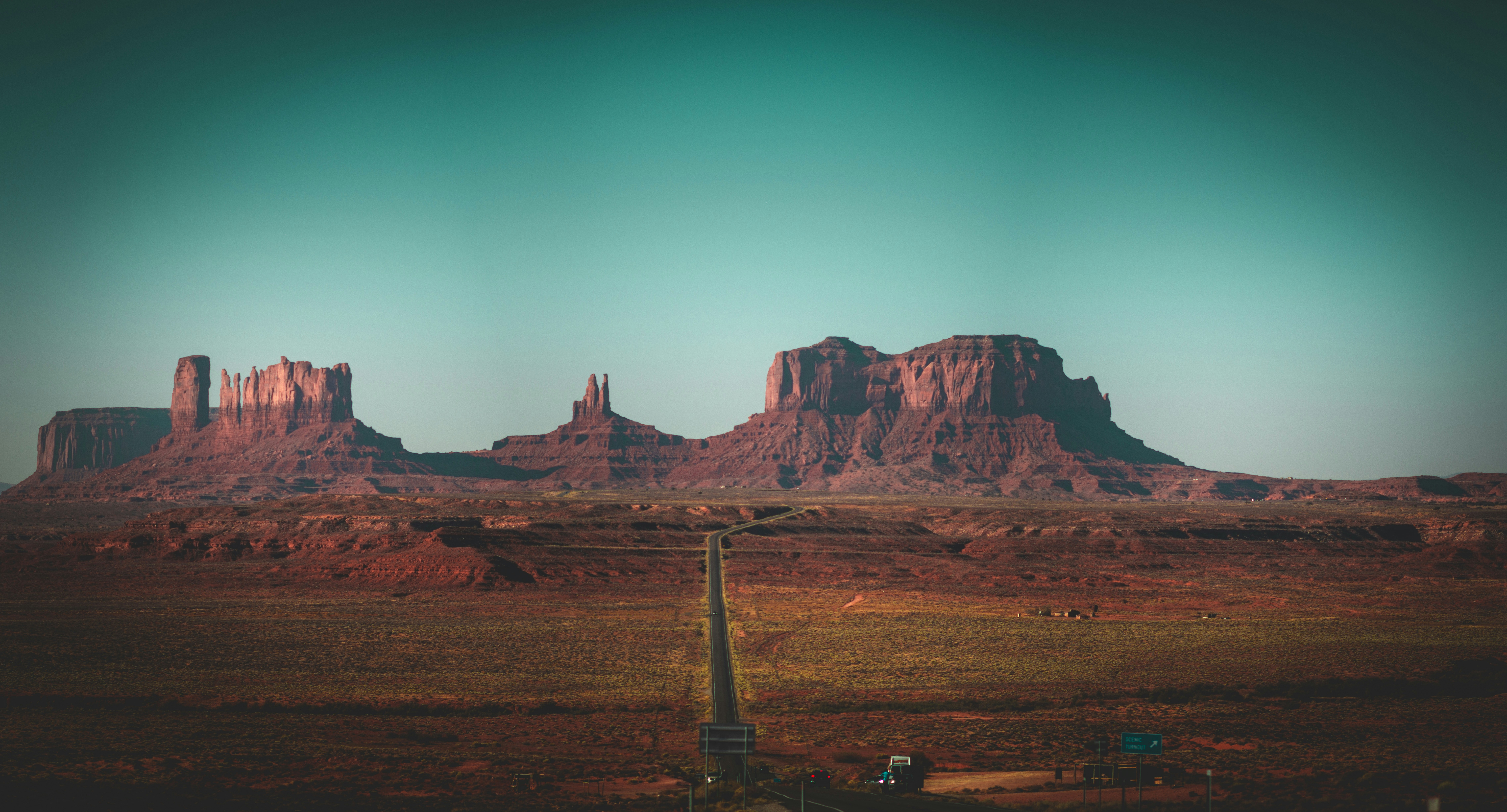 brown rock formation under blue sky during daytime