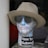 A mannequin head is covered in a map of the New York subway system, wearing a beige hat and sunglasses. The words 'New York Subway' are prominently displayed on the neck area. The background is dark and neutral.