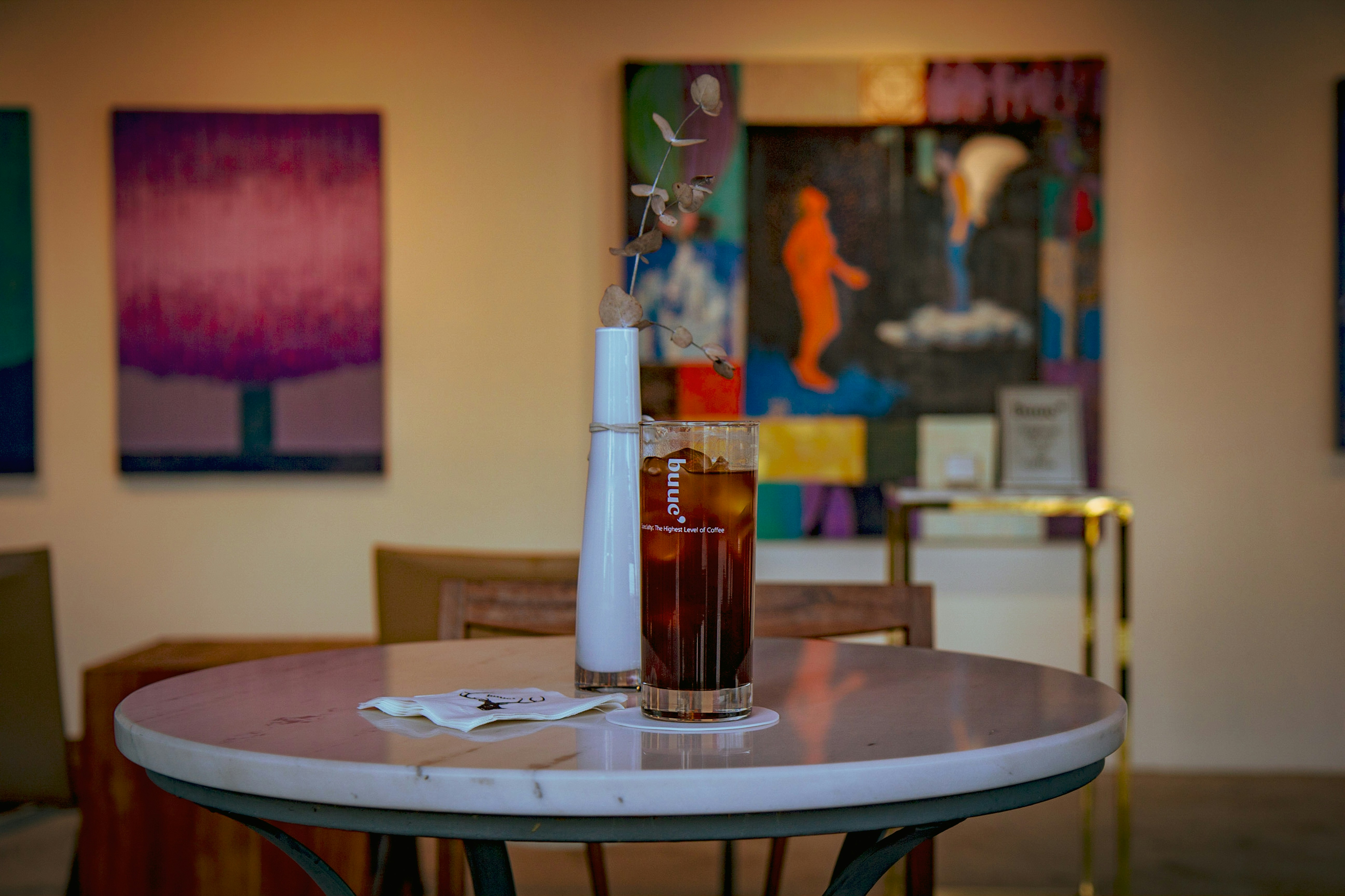 clear glass bottle on brown wooden table