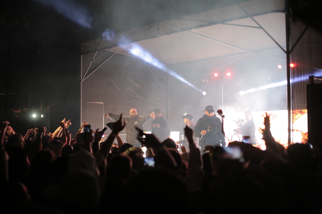 people standing on stage during nighttime