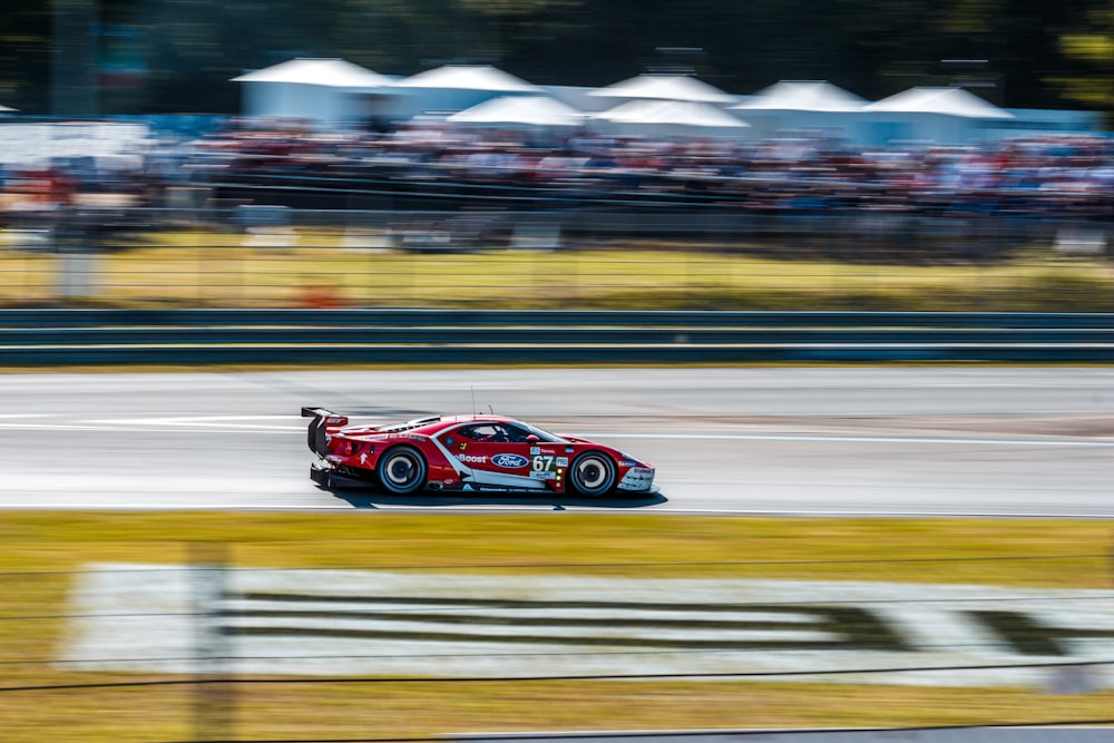 red ferrari f 1 on track