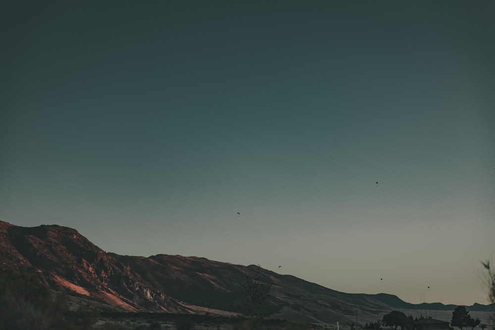 brown mountains under blue sky during daytime