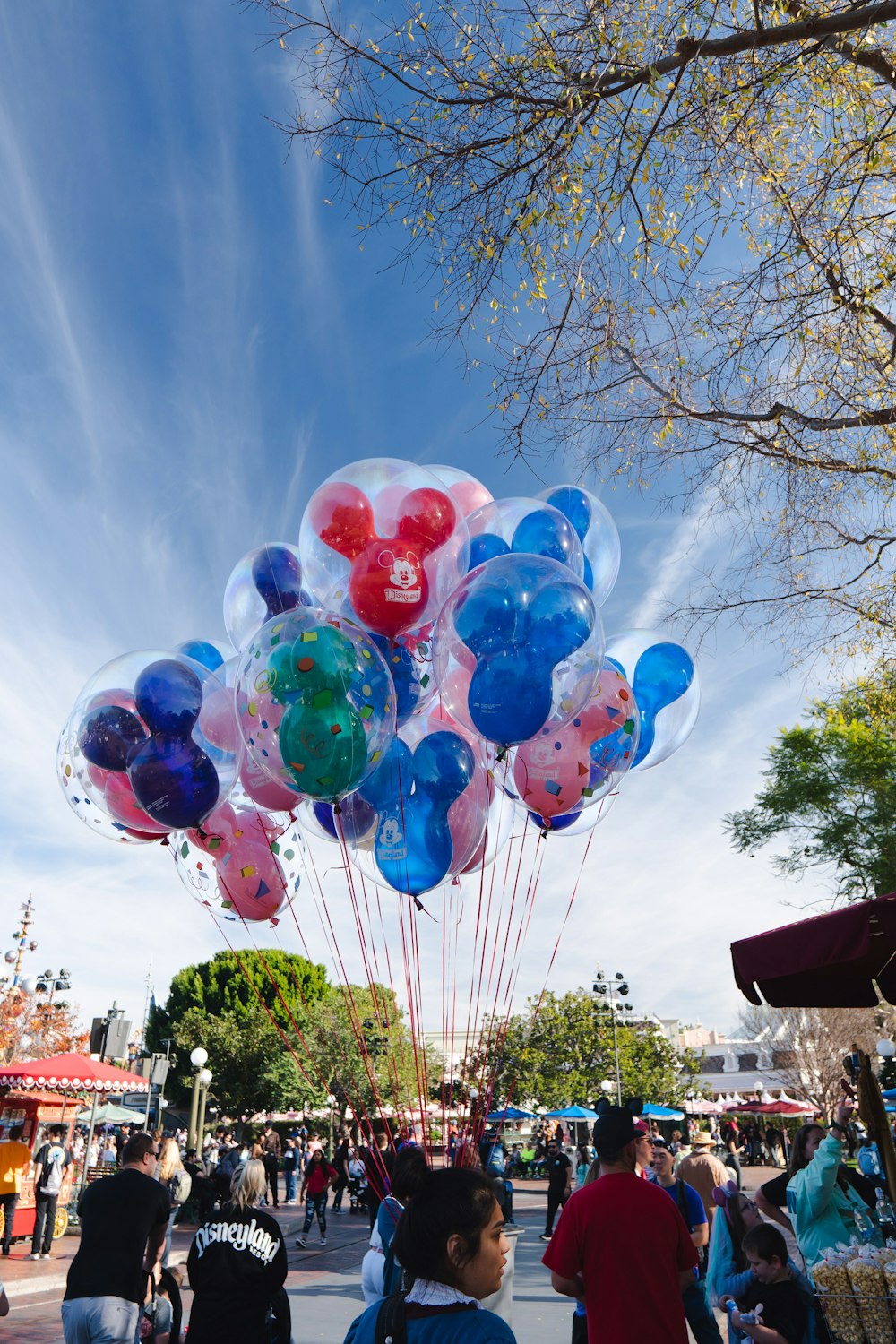 red blue and yellow balloons on air under blue sky during daytime