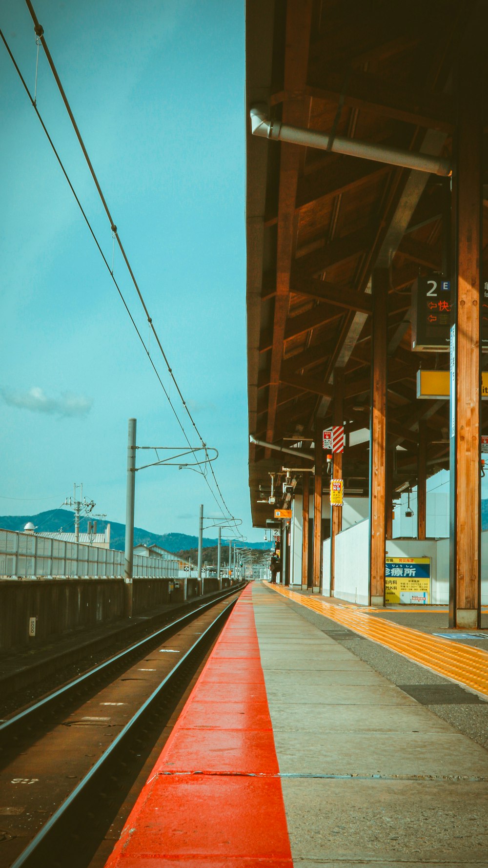 brown wooden bridge under blue sky during daytime