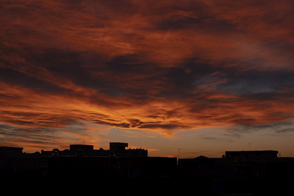 silhouette of buildings during sunset