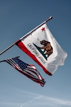 us a flag under blue sky during daytime