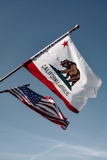 us a flag under blue sky during daytime