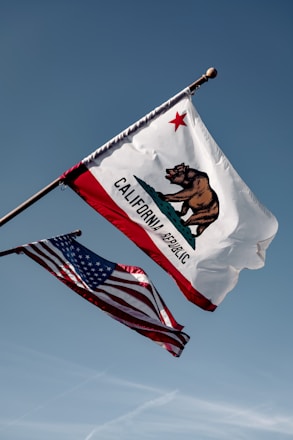 us a flag under blue sky during daytime
