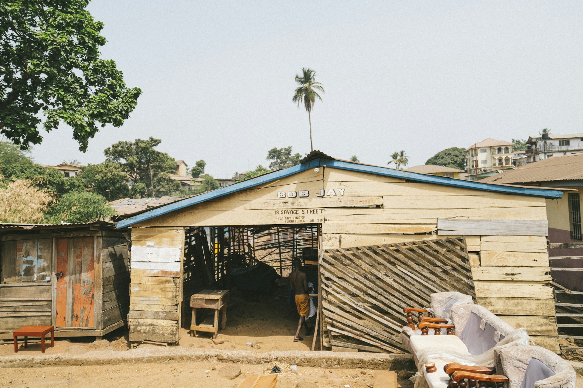 woman wearing yellow long-sleeved dress under white clouds and blue sky during daytime