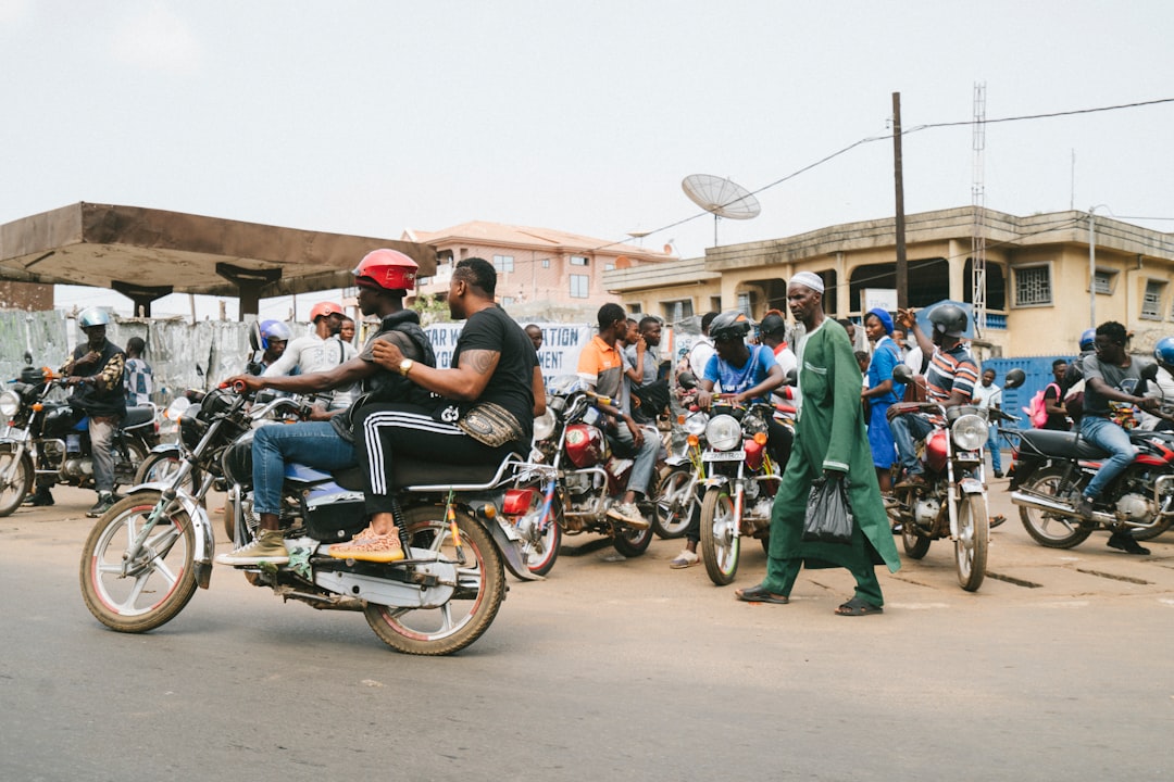 people riding on motorcycle during daytime