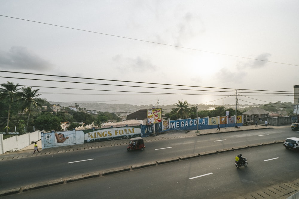 blue and yellow bus on road during daytime