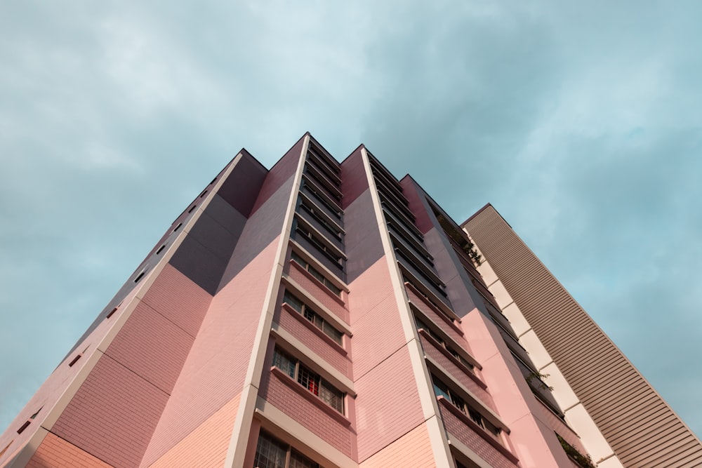 brown and white concrete building under blue sky during daytime