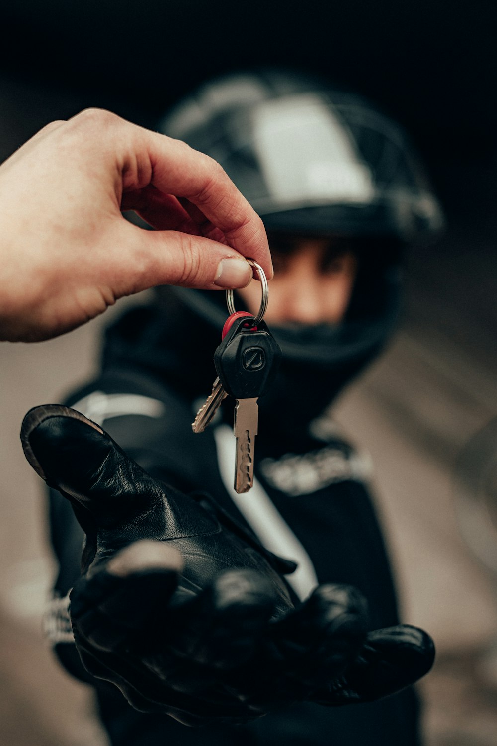 person holding black and silver key