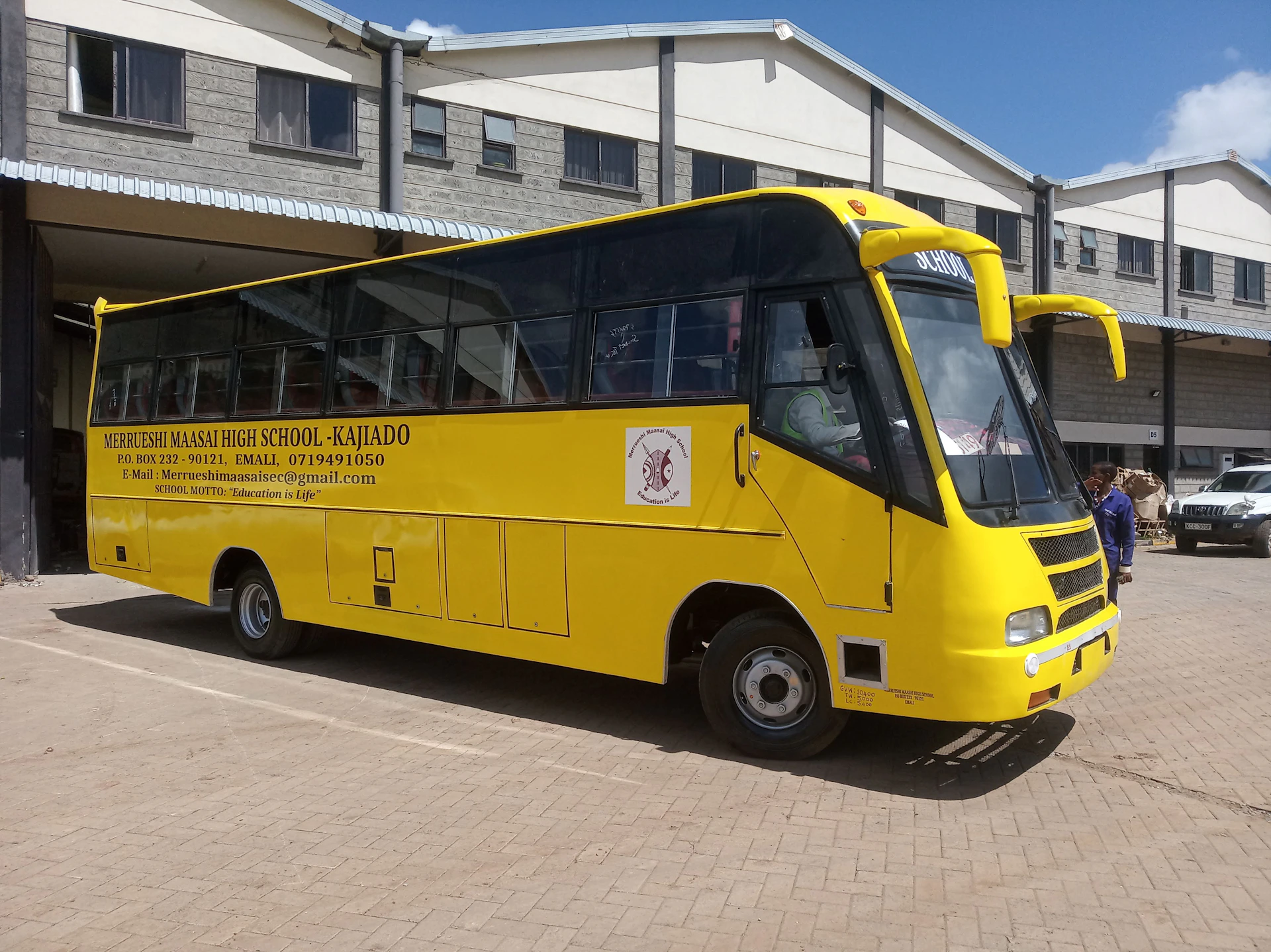 woman wearing yellow long-sleeved dress under white clouds and blue sky during daytime