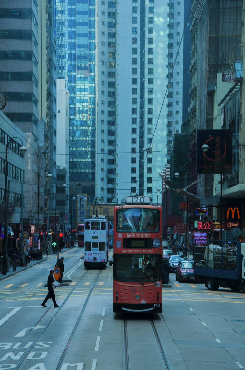 red double decker bus on road during daytime