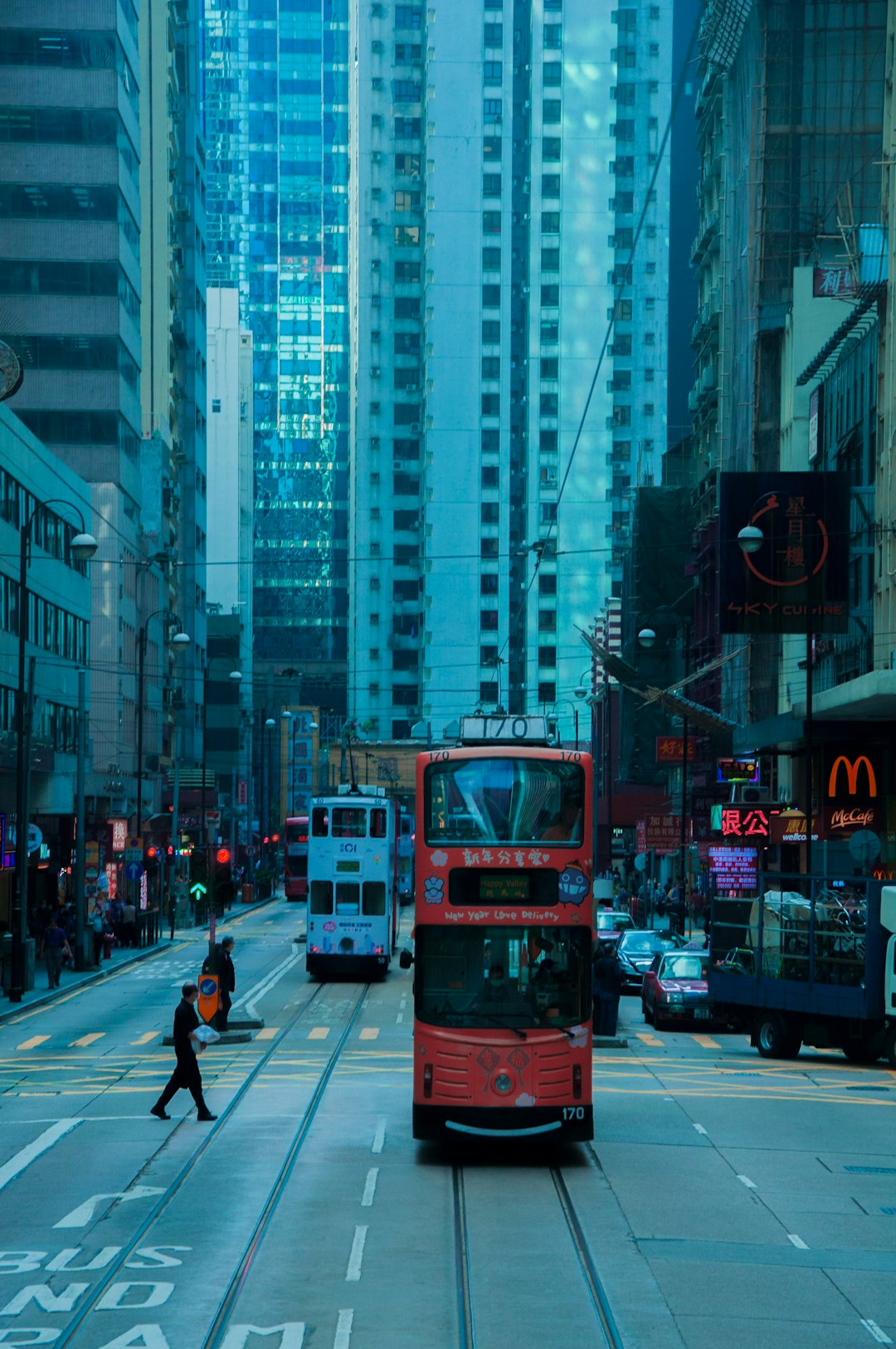 red double decker bus on road during daytime