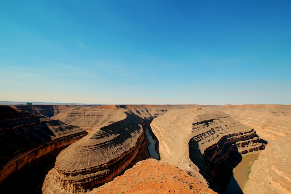 brown rock formation under blue sky during daytime