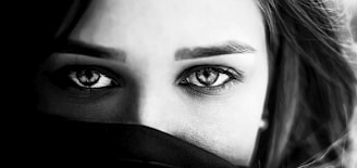 grayscale photo of persons eye