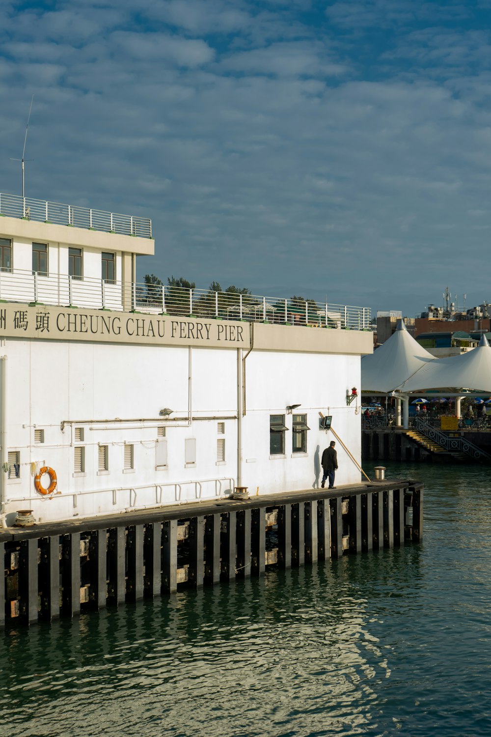 white concrete building near body of water during daytime