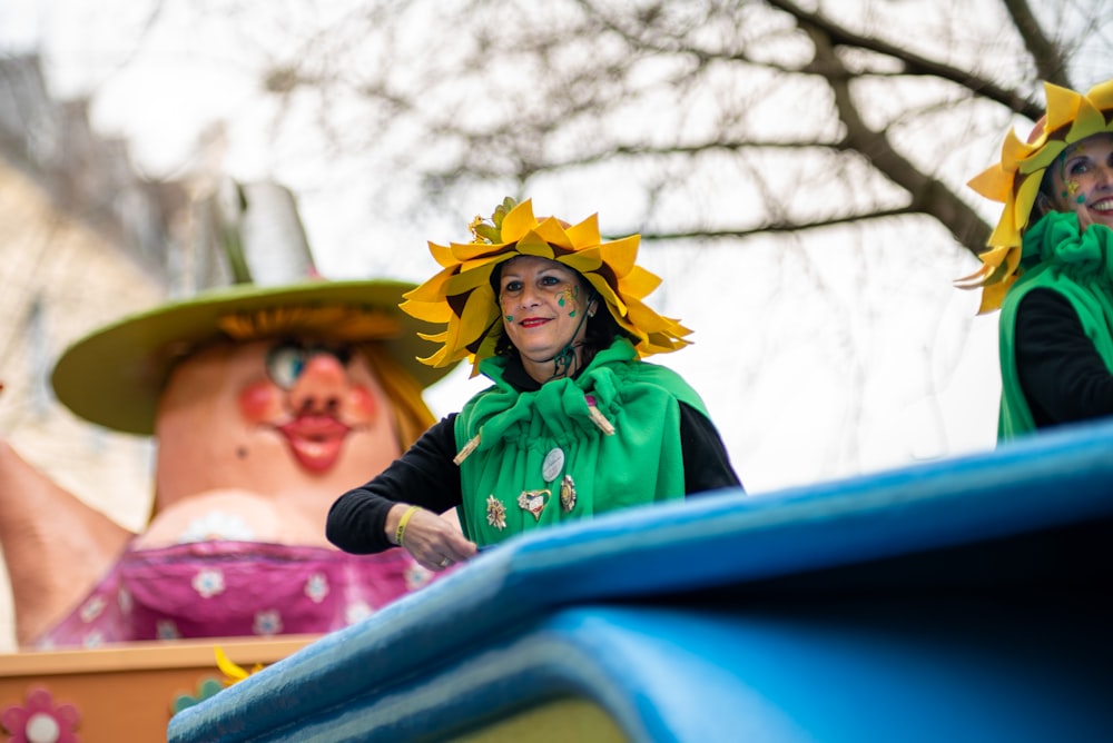 woman in green and yellow hat and black jacket