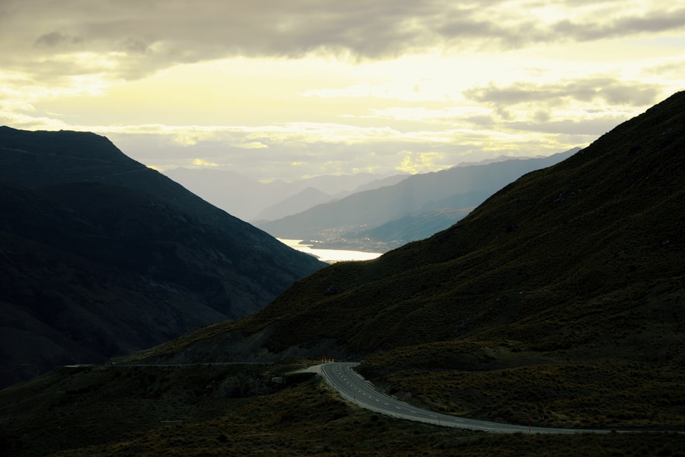 green mountains under white clouds during daytime