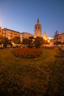 A cozy English garden with mysterious blooming flowers under a soft twilight.
