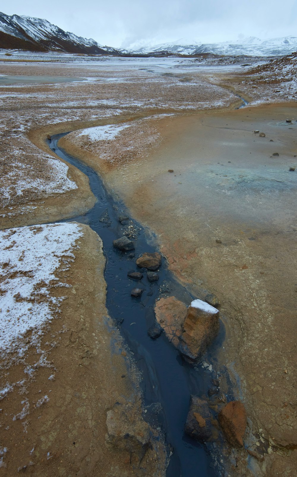 brown and white sand with water