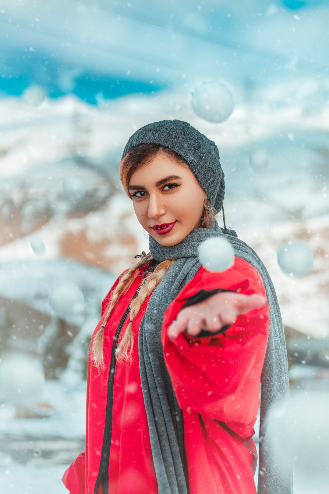 girl in red and black jacket and black knit cap