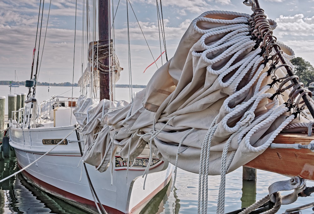 white and green boat on body of water during daytime