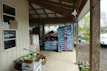 Bags of natural compost and fertilizers arranged neatly in a garden shed