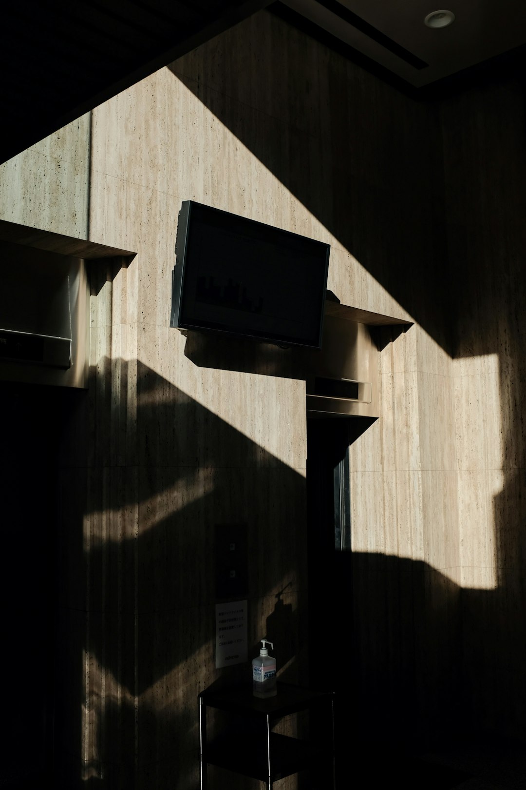 black flat screen tv on brown wooden wall