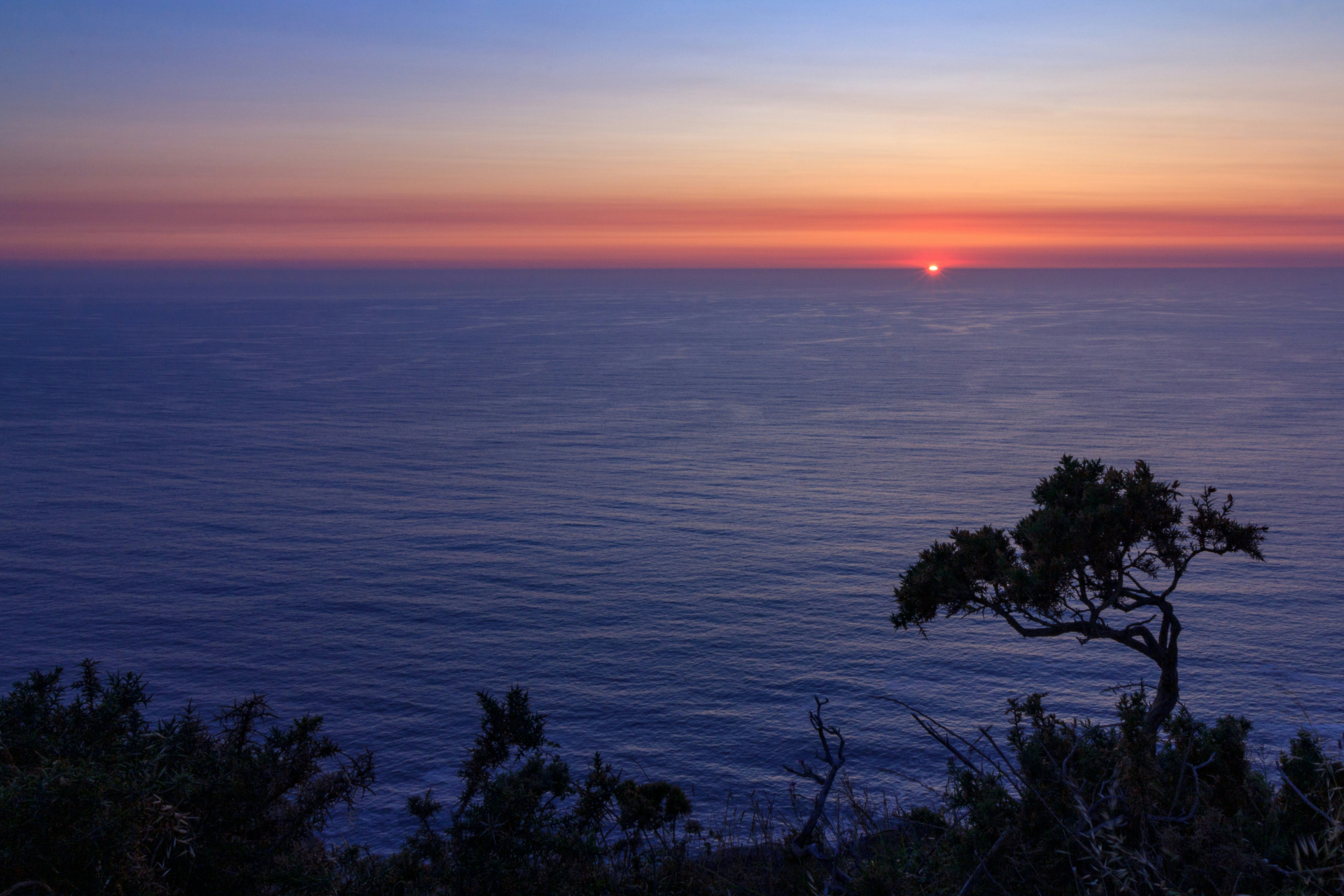 sunset, sea, ocean, atlantic, sky, galicia, monte facho, beach, coast, landscape, summer, maritime, nautical, lighthouse, blue, vacation, nature, cape, cabo, home, silhouette, balance, golden hour, zen, meditation, harmony Sun
