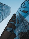 blue glass walled high rise building