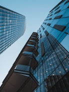 blue glass walled high rise building