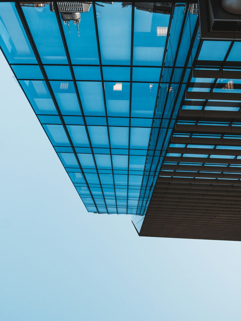 blue glass walled high rise building