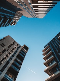 white and black concrete building under blue sky during daytime