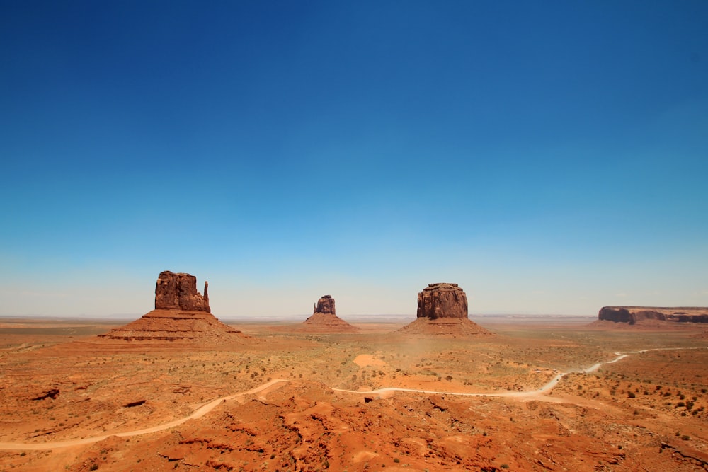 brown sand under blue sky during daytime