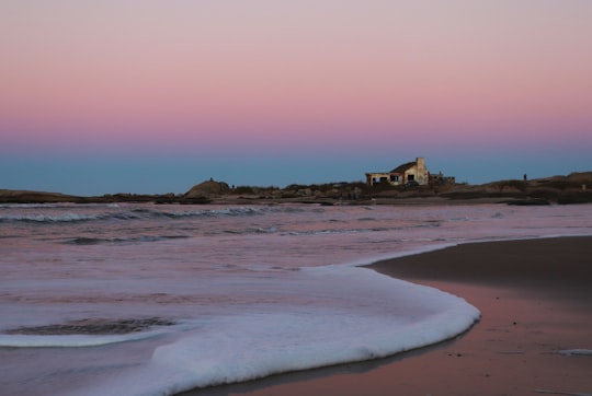 beach shore with ocean waves during daytime in Punta del Diablo Rocha Uruguay